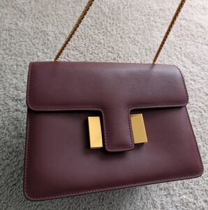 Elegant Maroon Leather Bag with Gold Accents